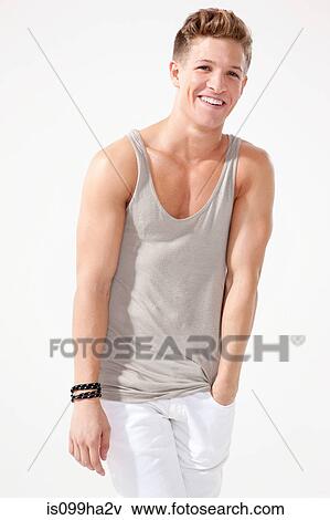 Young man with hand in pocket View Large Photo Image Stock Photo - Young man with hand in pocket. Fotosearch