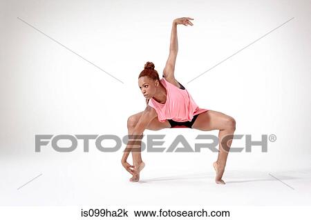 Stock Image - Young woman dancing. Fotosearch