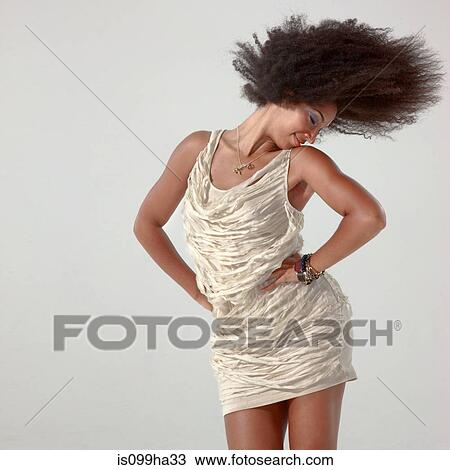 Young woman in motion View Large Photo Image Stock Image - Young woman in motion. Fotosearch