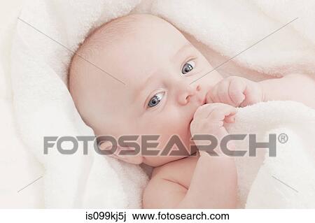 Stock Image - Baby boy in a blanket. Fotosearch