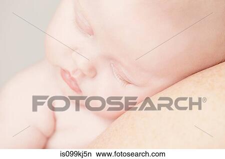 Baby girl sleeping on shoulder View Large Photo Image Picture - Baby girl sleeping on shoulder. Fotosearch