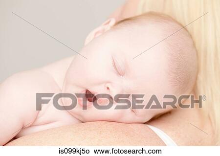 Picture - Baby girl yawning. Fotosearch