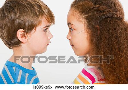 Boy and girl face to face View Large Photo Image Stock Photo - Boy and girl face to face. Fotosearch