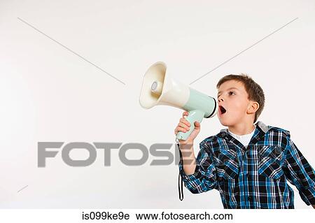 Stock Image - Boy shouting through megaphone. Fotosearch