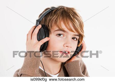 Boy wearing headphones View Large Photo Image Stock Image - Boy wearing headphones. Fotosearch