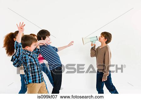 Boy with megaphone, shouting at other children View Large Photo Image Stock Photo - Boy with megaphone, shouting at other children. Fotosearch