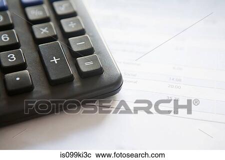 Stock Image - Calculator and bill. Fotosearch