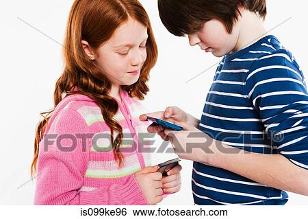 Children looking a smartphones View Large Photo Image Stock Photograph - Children looking a smartphones. Fotosearch