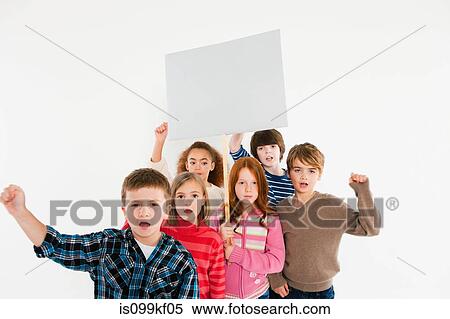 Stock Photography - Children protesting with placard. Fotosearch