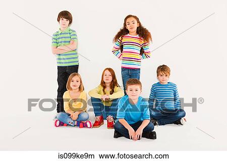 Children sitting and standing View Large Photo Image Picture - Children sitting and standing. Fotosearch