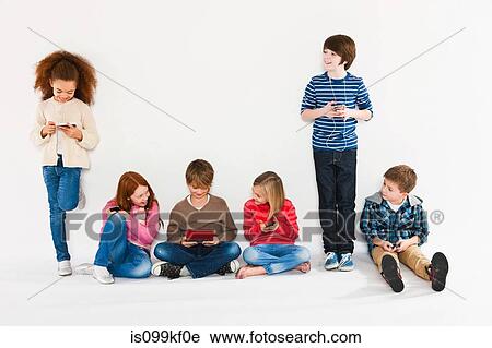 Children using different gadgets View Large Photo Image Stock Image - Children using different gadgets. Fotosearch