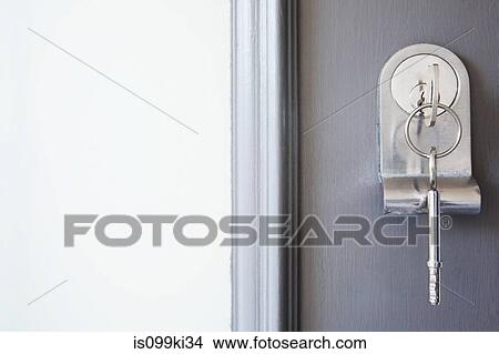 Close up of key in a front door View Large Photo Image Picture - Close up of key in a front door. Fotosearch