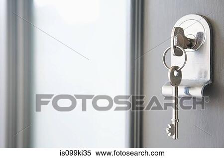 Close up of key in a front door View Large Photo Image Stock Photography - Close up of key in a front door. Fotosearch