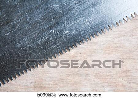 Close up on saw and wood View Large Photo Image Stock Image - Close up on saw and wood. Fotosearch