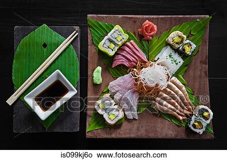 Dish of sashimi and sushi rolls View Large Photo Image Picture - Dish of sashimi and sushi rolls. Fotosearch