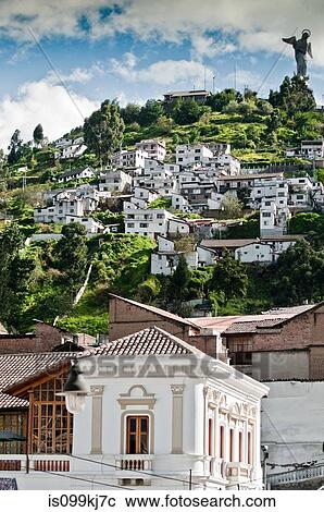 Stock Image - El Panecillo with winged Virgin Statue at top of hill, Quito, Ecuador. Fotosearch