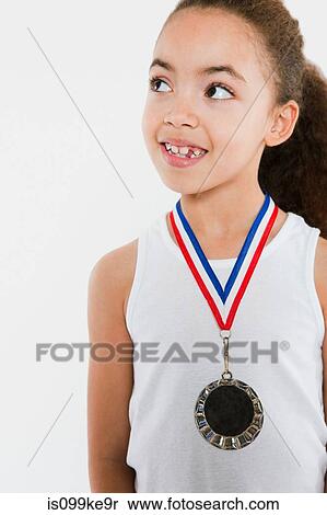 Girl wearing a medal View Large Photo Image Stock Photography - Girl wearing a medal. Fotosearch