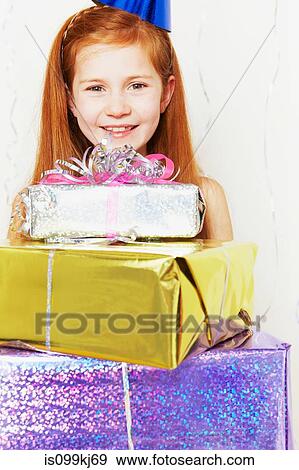 Girl with stack of birthday gifts View Large Photo Image Stock Photo - Girl with stack of birthday gifts. Fotosearch