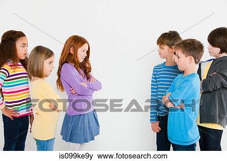 Girls and boys confronting each other View Large Photo Image Stock Photo - Girls and boys confronting each other. Fotosearch