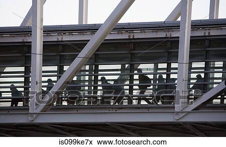 People on an elevated walkway View Large Photo Image Stock Photo - People on an elevated walkway. Fotosearch
