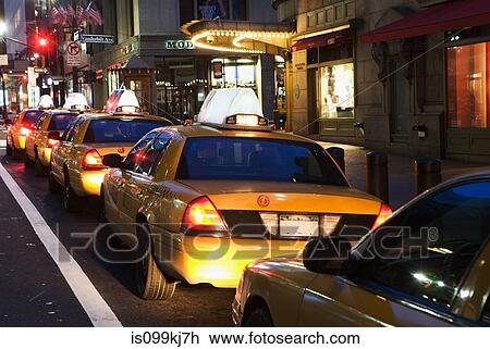 Stock Image - Queue of taxi cabs in New York City, USA. Fotosearch