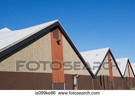 Row of industrial buildings View Large Photo Image Stock Photograph - Row of industrial buildings. Fotosearch