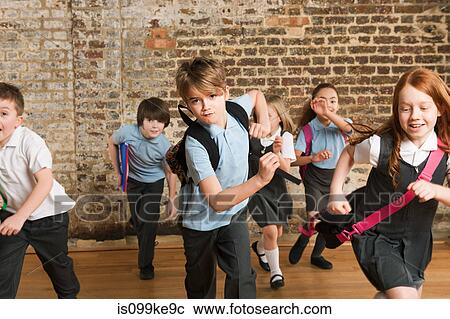 Stock Image - Schoolchildren running. Fotosearch