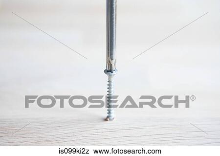 Screwdriver and screw View Large Photo Image Stock Photo - Screwdriver and screw. Fotosearch