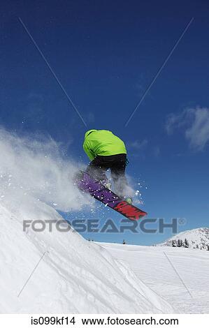 Snowboarder in mid air View Large Photo Image Picture - Snowboarder in mid air. Fotosearch