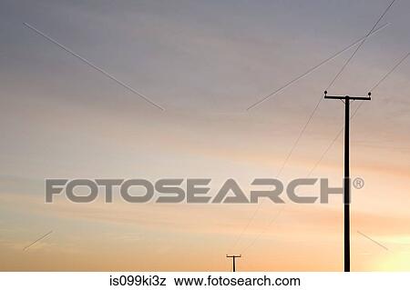 Telephone lines and evening sky View Large Photo Image Stock Photo - Telephone lines and evening sky. Fotosearch