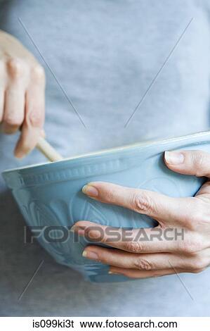 Woman with mixing bowl View Large Photo Image Stock Photograph - Woman with mixing bowl. Fotosearch