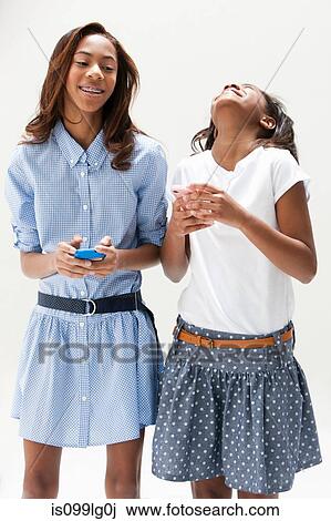 African American sisters laughing together, studio shot View Large Photo Image Stock Image - African American sisters laughing together, studio shot. Fotosearch