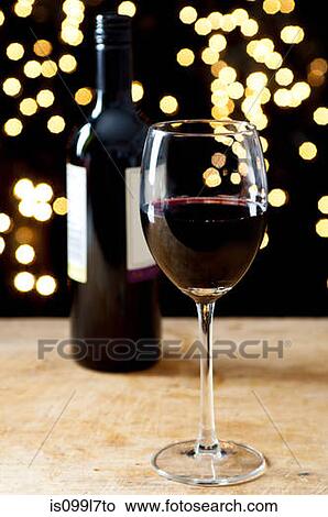 Picture - Bottle and glass of red wine. Fotosearch