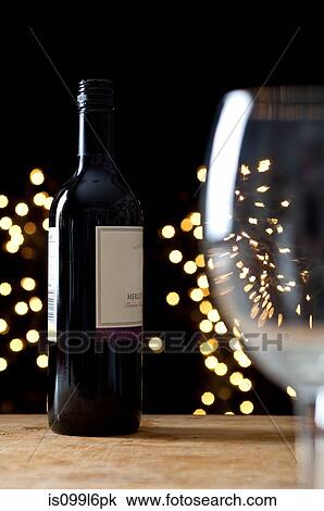 Bottle of red wine and empty glass View Large Photo Image Stock Image - Bottle of red wine and empty glass. Fotosearch