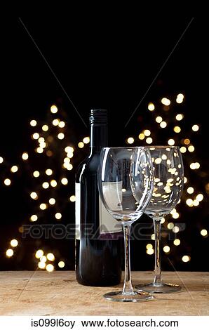 Bottle of red wine and two glasses View Large Photo Image Stock Photo - Bottle of red wine and two glasses. Fotosearch