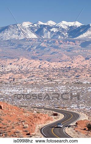 Car on highway in desert, Arches National Park, Utah, USA View Large Photo Image Stock Photo - Car on highway in desert, Arches National Park, Utah, USA. Fotosearch