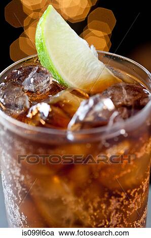 Cola drink with lime View Large Photo Image Stock Image - Cola drink with lime. Fotosearch