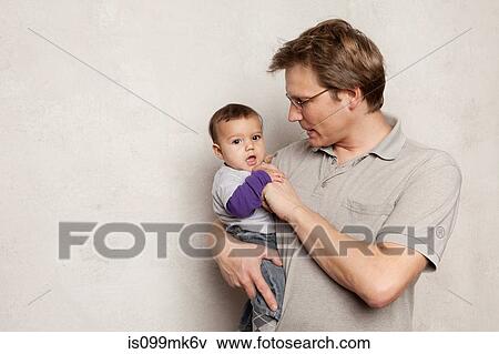 Stock Photo - Father and baby son. Fotosearch