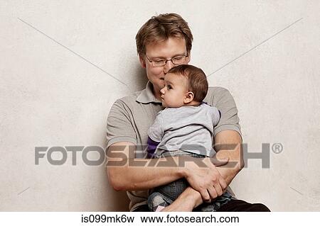 Father holding baby son View Large Photo Image Stock Photo - Father holding baby son. Fotosearch
