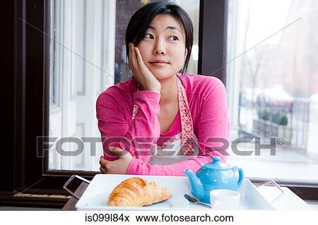 Female cafe owner thinking over breakfast View Large Photo Image Stock Photo - Female cafe owner thinking over breakfast. Fotosearch