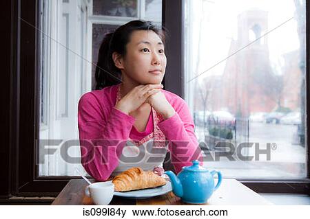 Female cafe owner thinking over breakfast View Large Photo Image Stock Photo - Female cafe owner thinking over breakfast. Fotosearch