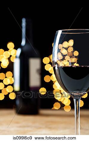 Glass and bottle of red wine View Large Photo Image Stock Photo - Glass and bottle of red wine. Fotosearch