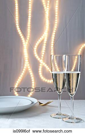 Stock Image - Glasses of champagne on table at an event. Fotosearch