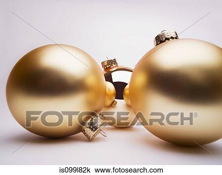 Gold Christmas decorations, studio shot View Large Photo Image Stock Image - Gold Christmas decorations, studio shot. Fotosearch