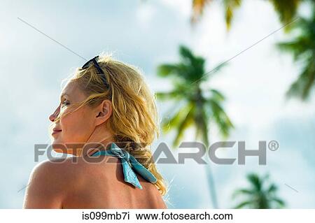 Stock Image - Head and shoulders of woman on vacation. Fotosearch