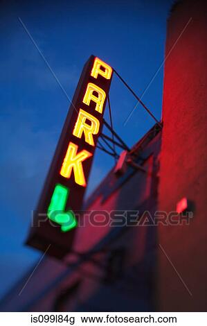 Illuminated neon parking sign on building View Large Photo Image Stock Image - Illuminated neon parking sign on building. Fotosearch