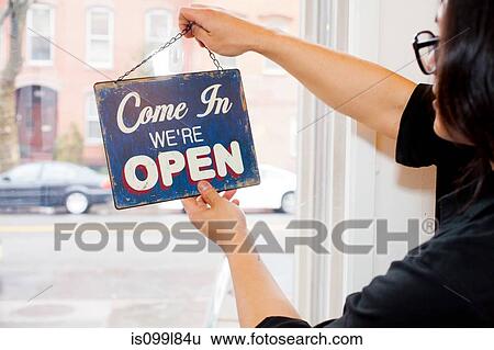 Man flipping over open sign in cafe View Large Photo Image Stock Photograph - Man flipping over open sign in cafe. Fotosearch