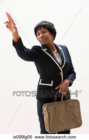Mature African American businesswoman gesturing, studio shot View Large Photo Image Stock Photography - Mature African American businesswoman gesturing, studio shot. Fotosearch