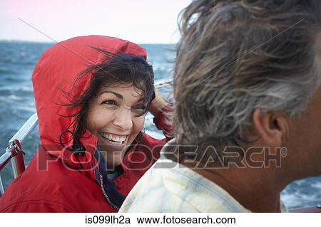 Stock Image - Mature couple sailing, close up. Fotosearch