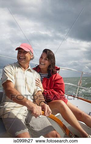 Mature couple sailing View Large Photo Image Stock Photo - Mature couple sailing. Fotosearch